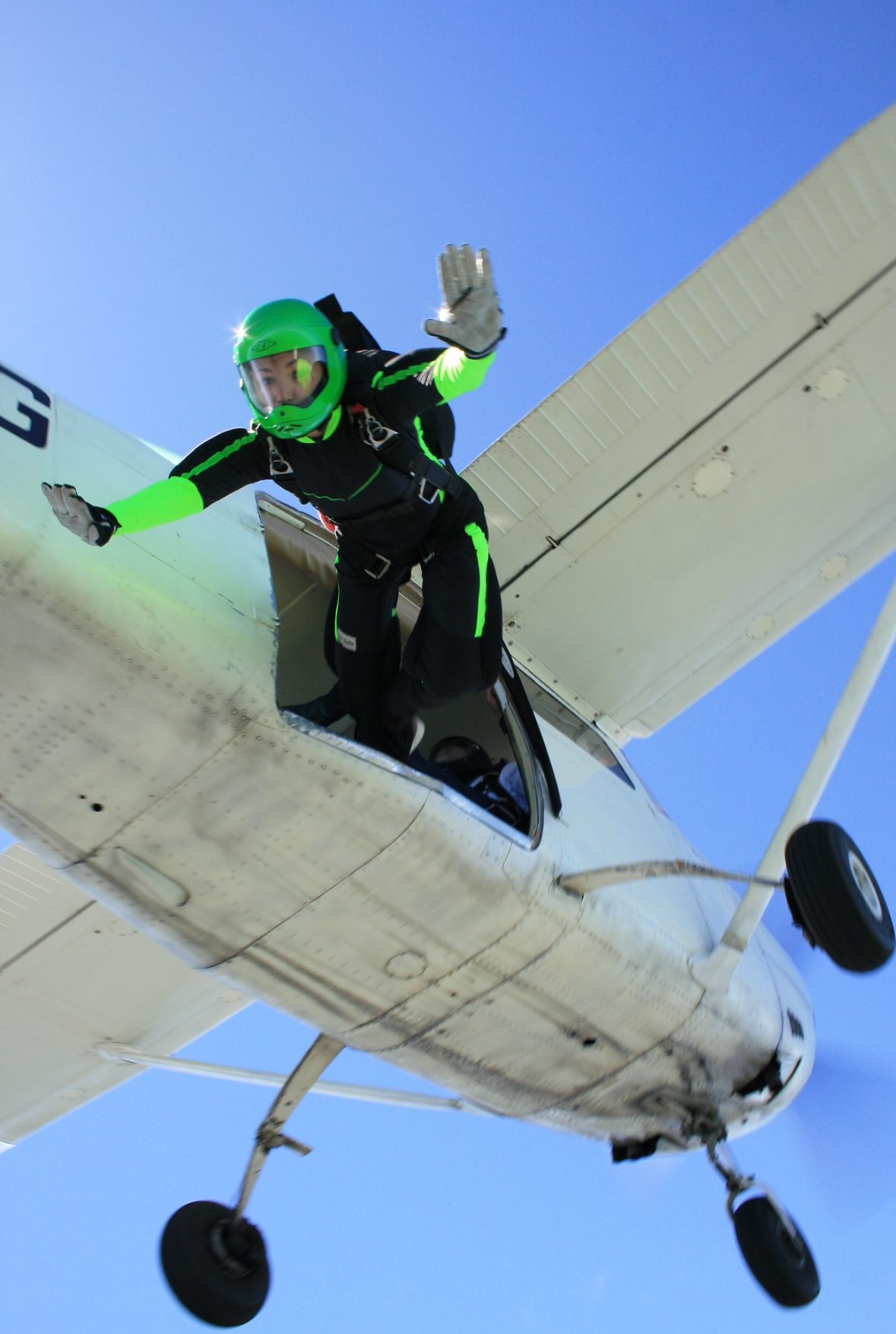 Sam Rad exiting an aircraft as a competitive skydiver